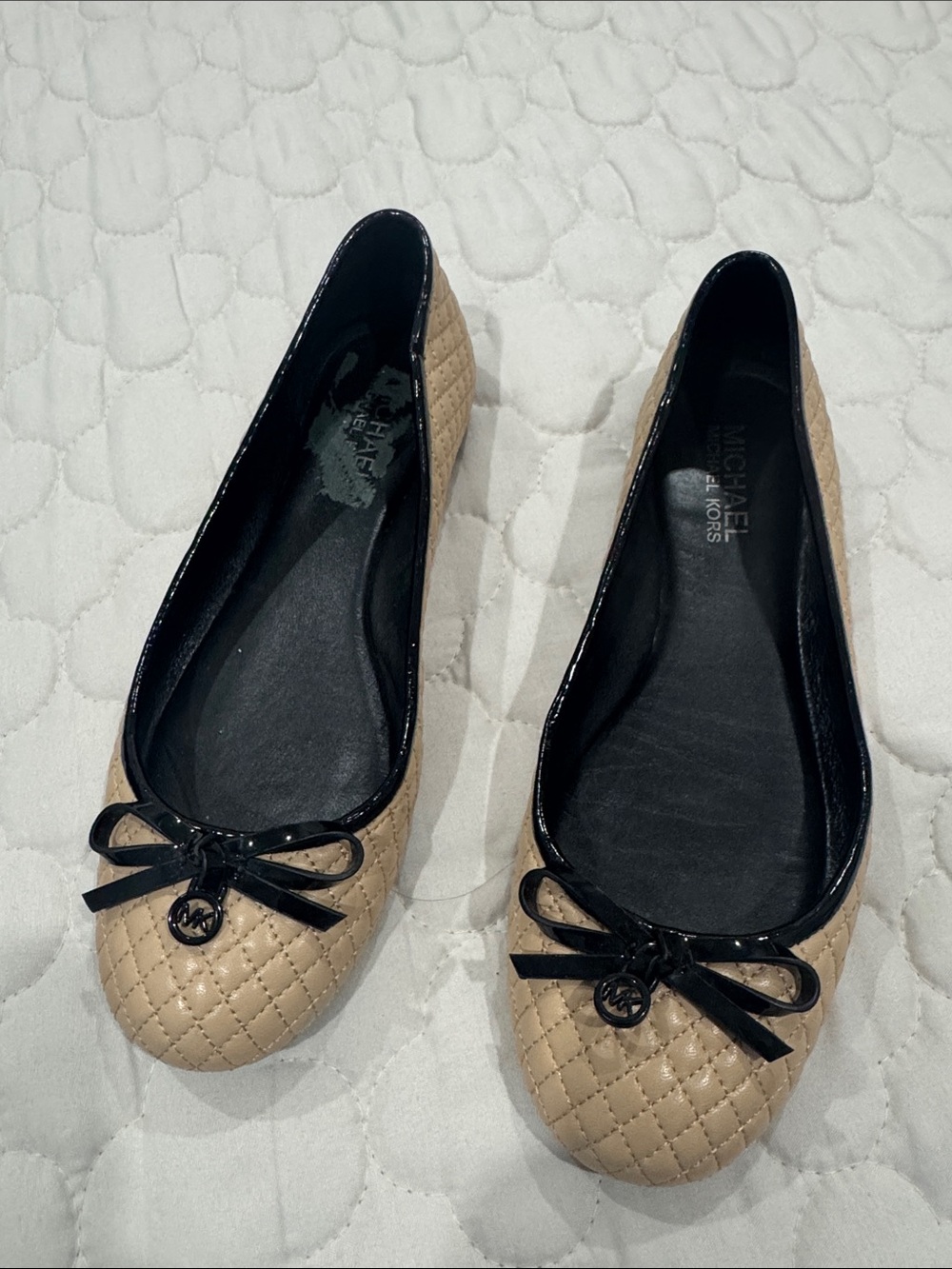 Michael Kors Quilted Beige Ballet Flats with Black Patent Trim and Bow Charm